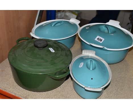 FOUR LE CREUSET CASSEROLE DISHES to include a lidded 18cm turquoise dish, a circular 24cm ovoid turquoise casserole dish, a 2