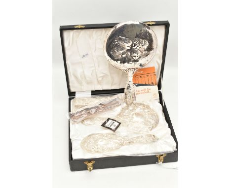 AN ELIZABETH II VANITY SET AND A HAND HELD MIRROR, a black square form case, encasing a comb, hand held mirror, a hair brush 