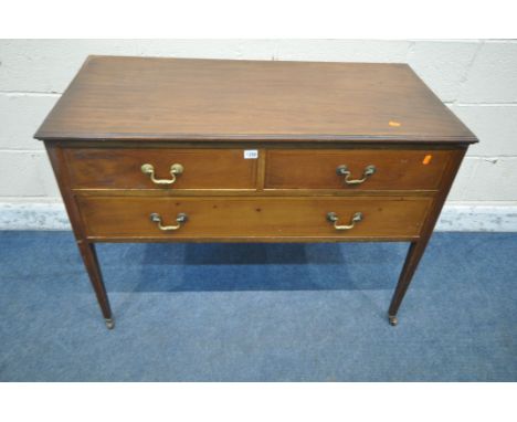 AN EDWARDIAN MAHOGANY DRESSING CHEST, fitted with two short over one long drawer, raised on square tapered legs and ceramic c