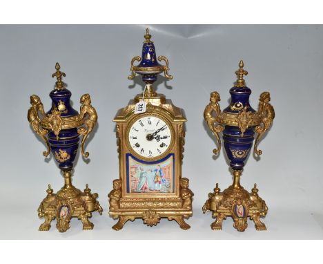 AN ITALIAN CLOCK GARNITURE, gilt metal and ceramic, the garniture faux covered vases, all pieces decorated with putti and fol