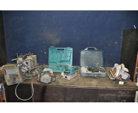 A COLLECTION OF POWER TOOLS including a vintage arc welding plant, a Makita finishing stand, a Makita 8400VD cordless drill b