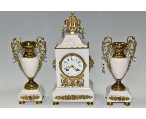 AN ALABASTER AND GILT METAL CLOCK GARNITURE, the central clock flanked by two urns, case surmounted by a gilt lyre finial, ra