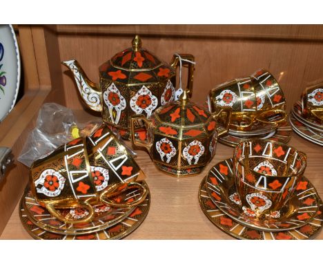 A BURTONDALE IMARI PATTERN TEA SET, comprising a teapot, octagonal covered sugar bowl, milk jug, twelve tea cups, twelve sauc