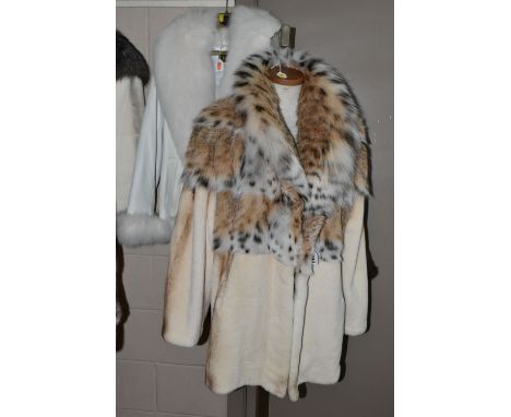 THREE LADIES' LEATHER AND FUR JACKETS, comprising a pale cream fur jacket with  lynx fur collar and shoulders, a Belle Fare m