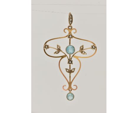 A YELLOW METAL LAVALIER PENDANT, open work floral design, set with a central circular cut blue topaz and blue topaz dropper, 