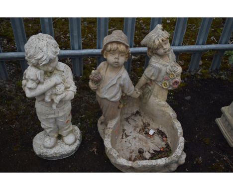 A WEATHERED COMPOSITE PLANTER, with two standing children holding hands, height 64cm, along with a composite figure of a boy 