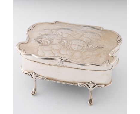 A silver jewellery box made by Alexander Clark, Birmingham 1905, the cover of the box has repousse decoration with five angel