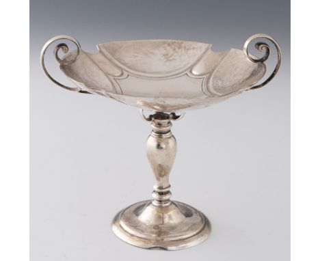 An Arts and Crafts sterling silver footed dish made by James Dixon in Sheffield 1905, with scrollwork handles supported by an