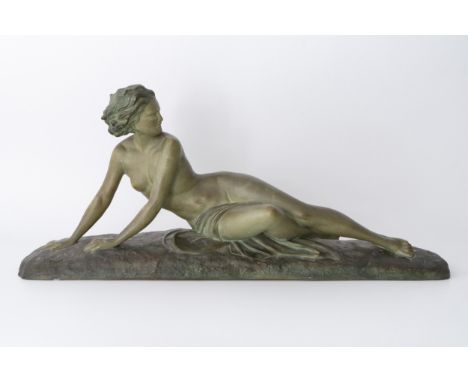 A French Art Deco terracotta sculpture by Ugo Cipriani (1887-1960) c.1935, a young woman with a verdigris colour stain giving
