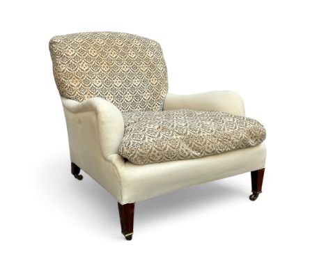 An early 20thC Edwardian Howard & Sons deep-seated 'Bridgewater' armchair, the back leg stamped '16682 7385 HOWARD & SONS LTD