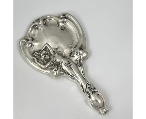 An Art Nouveau sterling silver hand mirror made by Webster & Co, the reverse features an ethereal lady within a crooked borde
