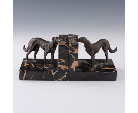 A pair of 1930s French/Italian Art Deco bronze greyhound bookends, with bronze standing greyhounds with portoro marble stands