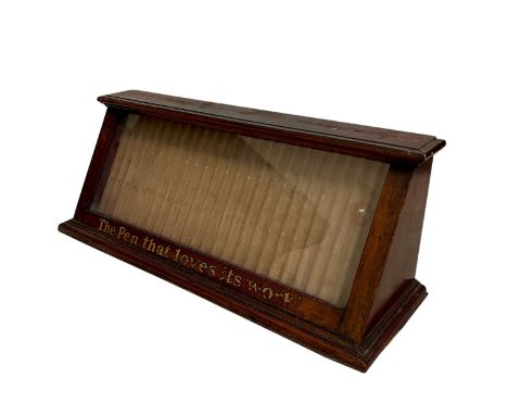 A 1920s-30s Davey's Ltd Display Equipment Specialists Parker (?) pen cabinet, the mahogany body with angled panel of glass an