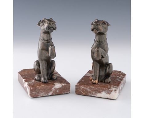 A pair of Irish terrier-type dog spelter bookends c.1940, depicting an Irish terrier-type dog with raised paw on a red marble