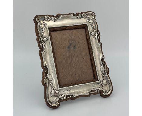 A sterling silver photo frame Selfridge & Co, Birmingham 1909, 20.5cm length by 16.5cm width, total weight 227g. (LC16232) CO