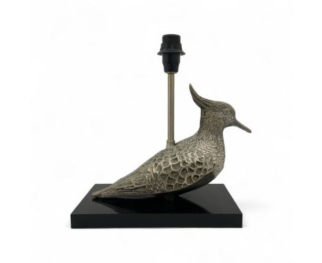 A mid-late 20th century plated metal table lampbase, in the form of a Lapwing bird, mounted on a black Perspex base, with Bak