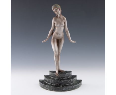 A 1920s-30s Art Deco French silvered bronze sculpture by Marcel Bouraine (1886-1948), the young lady wearing a green and gold