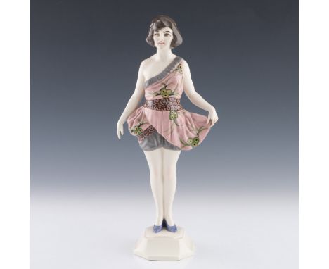 A 1920s Czech Art Deco Hohenstein figure of a woman in a fashionable dress, marked to underside 'CZECHOSLOVAKIA HOHENSTEIN 95