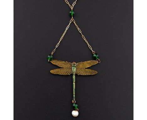 An Edwardian Art Nouveau dragonfly pendant necklace, the wings are delicately enamelled as is the body, it is suspended below