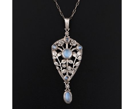 An Art Nouveau white metal pendant set with moonstones, shield-shaped with a ropework border with floral and foliate stems su