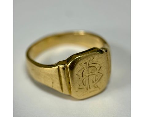 An 18ct yellow metal gentleman's signet ring, the top panel engraved with a fancy 'LB' or 'BL' monogram, the underside of the
