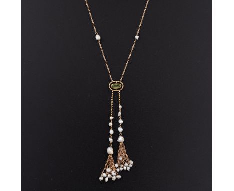 A peridot and seed pearl 9ct gold necklace, c.1910, chain with seed pearls set along its length and this supports a peridot m