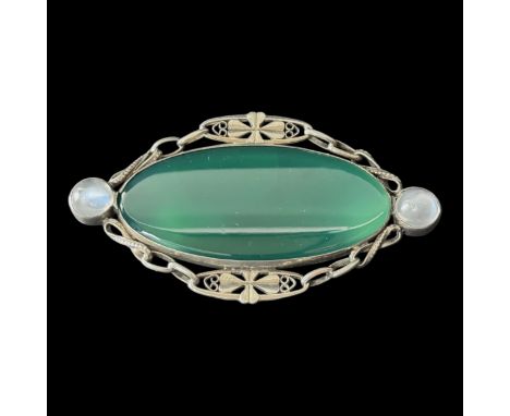 An Arts and Crafts dyed green agate and moonstone brooch attributed to Sybil Dunlop (British, 1889-1968), silver mounted, 5.9