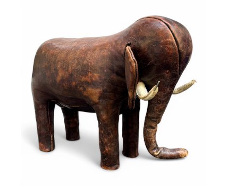 A 1960s-70s Omersa stitched brown leather elephant, designed by Dimitri Omersa (1927-75), with white leather curving tusks, b