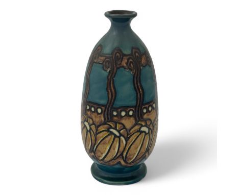 A French Art Nouveau HB Quimper Odetta vase, decorated with a row of stylised pumpkins against a wall and fence in tan and br