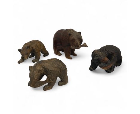 Four early 20th century Black Forest, or Black Forest-style, carved bears, the largest carved from a heavy hardwood on all fo
