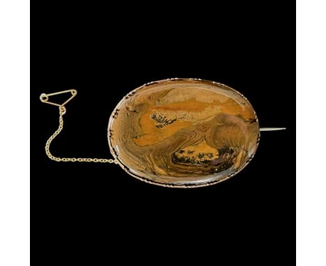 An early 19th century Egyptian jasper brooch with 15ct gold mount and safety chain, height of brooch is 6.5cm by 4.6cm width,