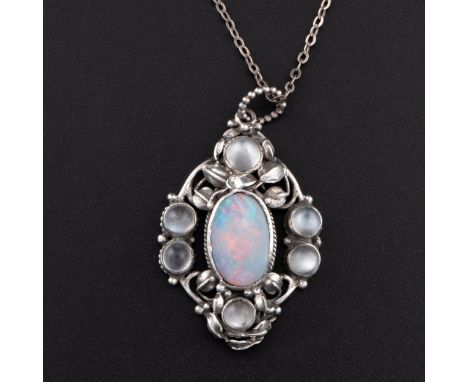 An Arts and Crafts pendant necklace with opal and moonstones, pendant with six moonstones set amongst white metal leaves with