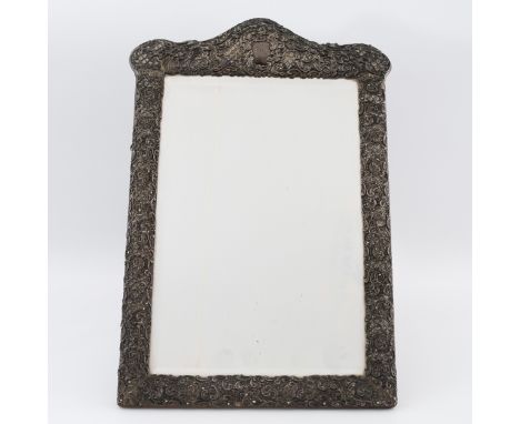 A large Victorian silver easel dressing table mirror, with embossed, die-cut pierced front with scrolling floral and foliate 