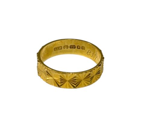 A 1960s 22ct gold ring, star cut and polished with panels of star motifs, with S&W maker's mark for Slade & Woolf Ltd, with s