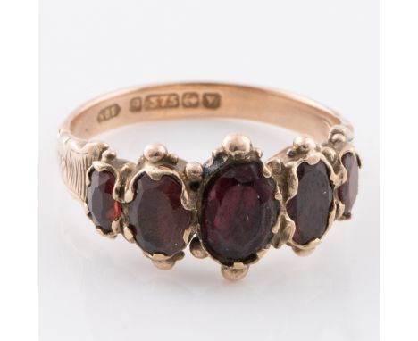 A 9ct gold ring with almandine garnets, manufactured in Birmingham in 1923, ring size N½, total weight 2.3g. (LC16257)CONDITI