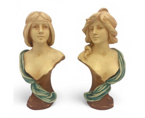 A pair of Art Nouveau Austrian Bernard Bloch ceramic busts of elegant ladies, modelled by Theodore Schoop, the backs of the i