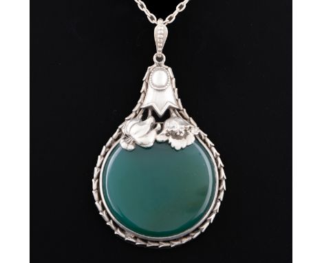 An early 20thC German or Austrian white metal mounted chalcedony pendant necklace, the translucent stone is supported by a be