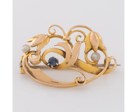 An Art Nouveau yellow metal brooch with topaz and seed pearls, stamped '15ct' below the hinge and on the reverse, 3cm by 1.9c