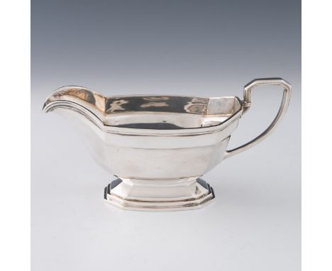 A silver sauce boat by Chatterley & Sons, Birmingham 1921, with a reeded border and terraced foot typical Deco silver design,
