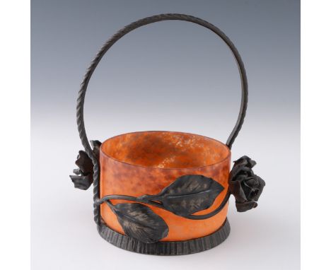 An early 20thC French Art Nouveau glass basket with wrought iron frame, the acid-matted mottled blood orange and purple glass