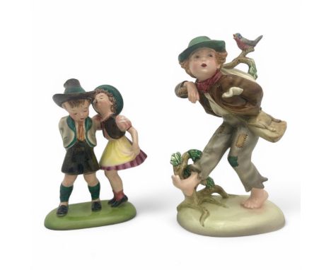 Two 1930s Austrian Keramos ceramic figurines, modelled by Stefan Dakon, comprising a young girl dressed as a hobo, carrying a
