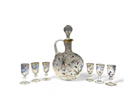 An late 19thC to early 20thC Czech enamelled and gilded decanter and glasses set, possibly by Harrach/Harrachov, decorated al