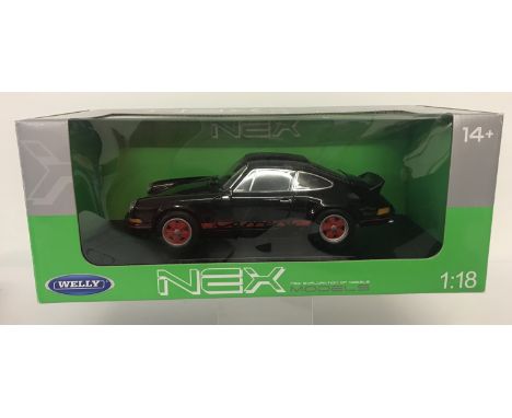 A boxed 1:18 scale Nex Models, 1973 Porsche 911 Carrera RS by Welly. In black and red colourway. From a private collection.