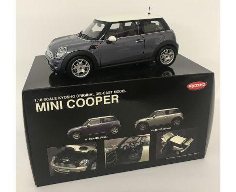 A brand new boxed, 1:18 scale, Mini Cooper by Kyosho. Metallic blue and white colourway. All original packaging, complete wit