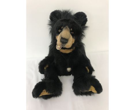 A large Charlie Bear "Norman" by Isabelle Lee, product number CB194201. Black long haired bear with tan face, chest patch and