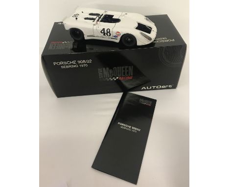 A boxed 1:18 scale, Steve McQueen Racing Porsche 908/02 Sebring 1970, by Autoart. Complete with leaflet and unused dusting cl