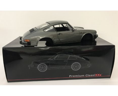 A boxed 1:12 scale limited edition Porsche 911 Carrera 3.2 coupe by Premium Classixxs. Only 500 pieces made. Front seats and 