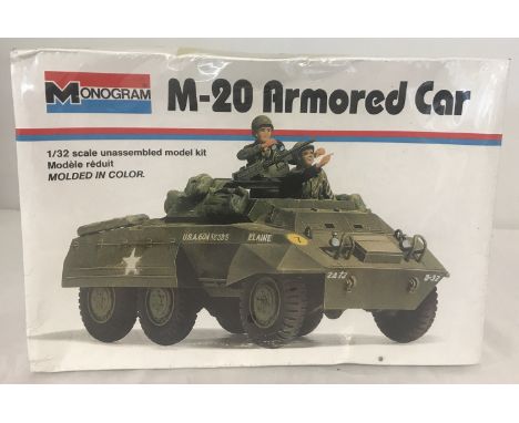 A vintage sealed, unopened and unassembled plastic model kit of M-20 Armored Car by Monogram. 1:32 scale. 