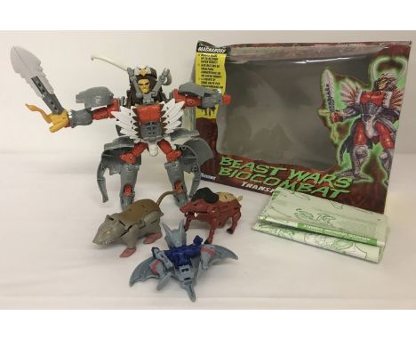 A collection of 1997 Kenner Toys Beast Wars Biocombat Transformers. Comprising: Boxed Maximal Magnaboss - consisting of 3 bea