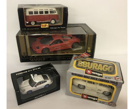 4 boxed diecast cars. A G.Gold Prototype LM by Guiloy 1:18 scale, VW campervan by Maisto 1:25 scale, Mercedes-Benz 300SL Carr